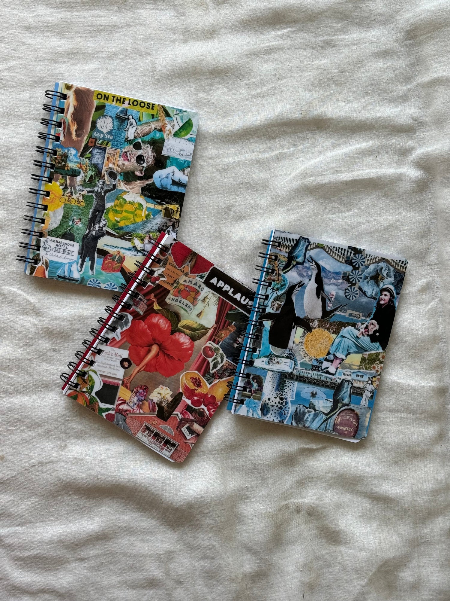 Mini spiral notebooks with collage covers on the front and back