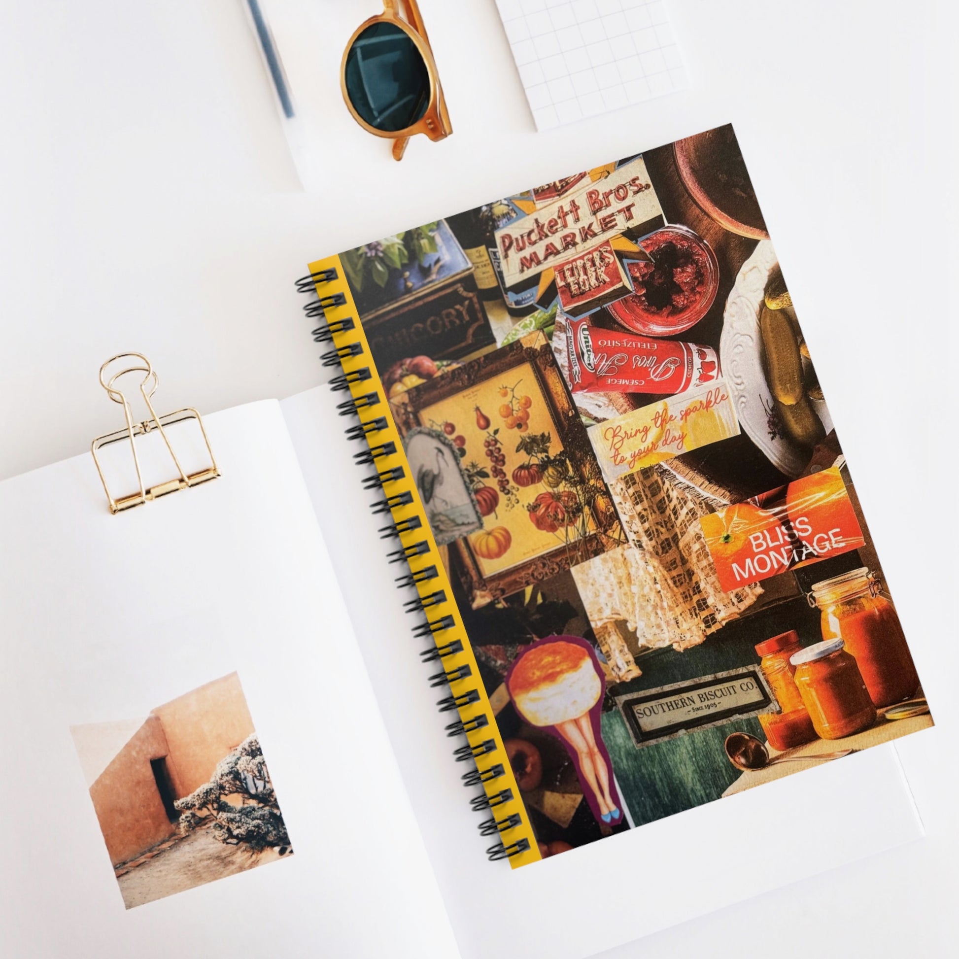 The 'Biscuit Babe' journal laid on a white surface with a pen, illustrating a potential writing setup, emphasizing the notebook's use in daily life.